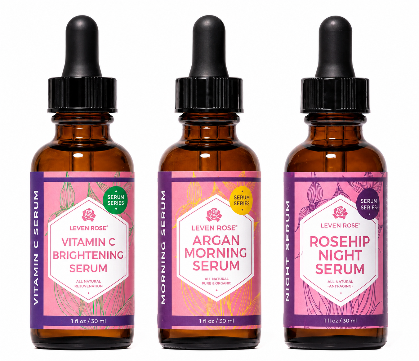 Three amber glass dropper bottles of Leven Rose serums lined up against a white background: Vitamin C Brightening Serum, Argan Morning Serum, and Rosehip Night Serum.