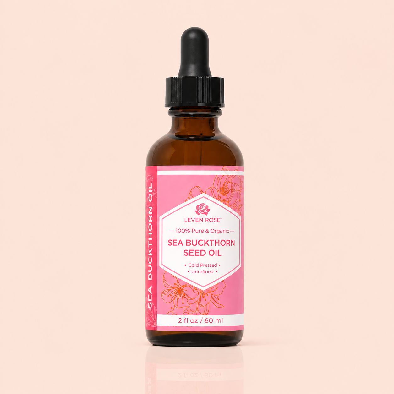 Bottle of Leven Rose Sea Buckthorn Seed Oil with a pink label on a beige background