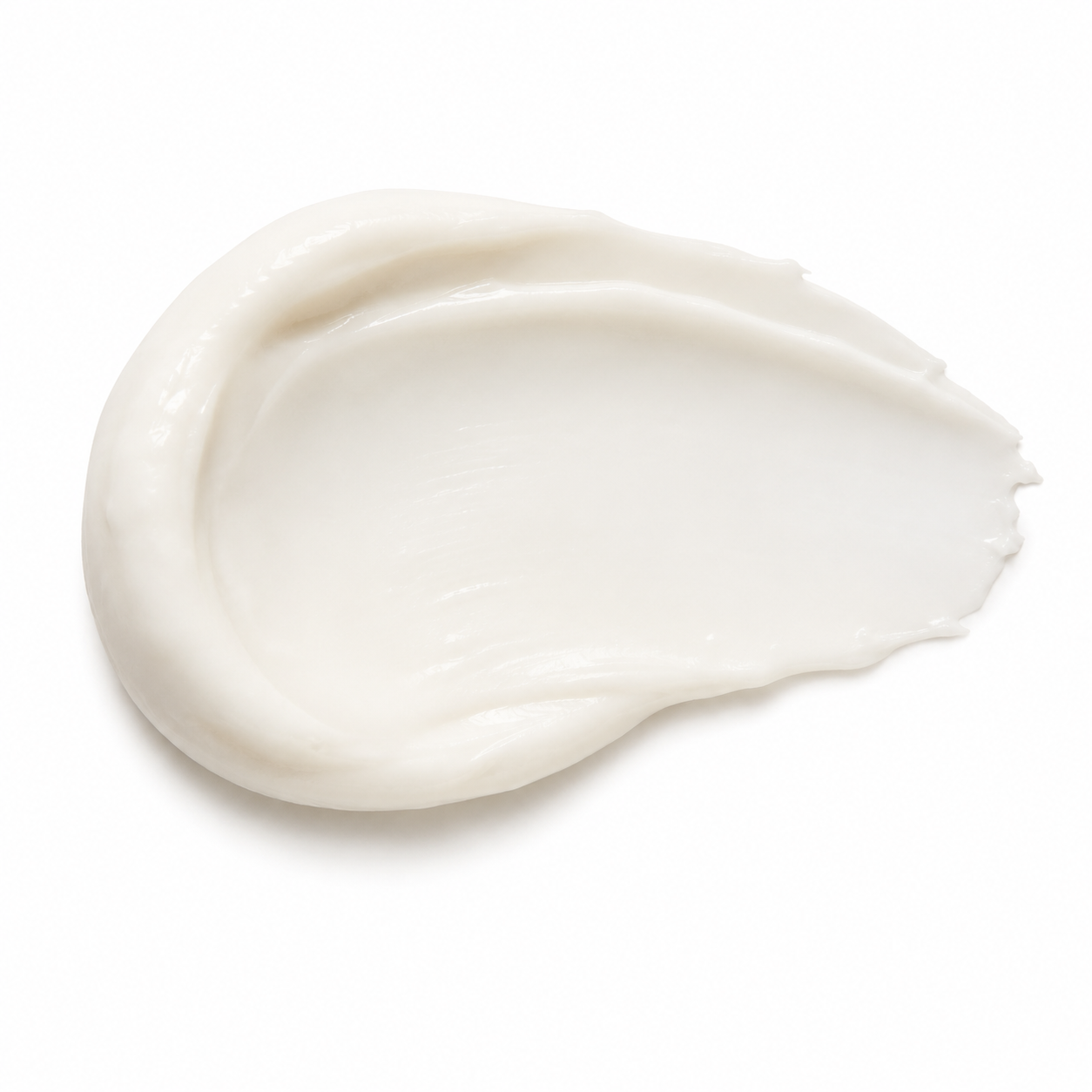 A thick, creamy white smear of lotion or balm on a clean white background.