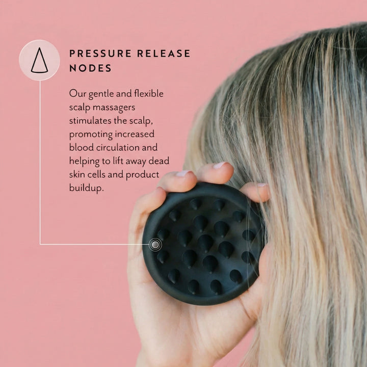 Person using a black scalp massager with text on a pink background