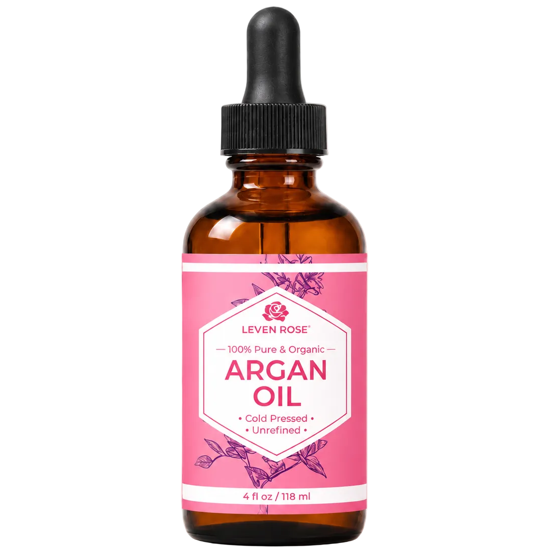 Bottle of Leven Rose Argan Oil with a pink label on a beige background