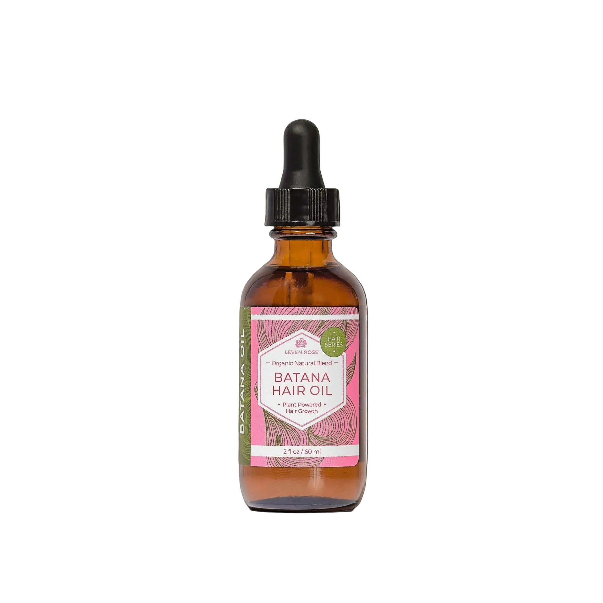 A bottle of Batana Hair Oil by Raw Nature, featuring an amber glass bottle with a black dropper cap and a pink and white label, centered against a solid black background.