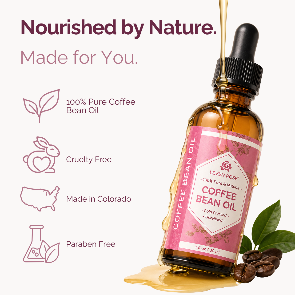 A bottle of Leven Rose Coffee Bean Oil with a pink label and black dropper cap, shown with golden oil dripping into it, coffee beans, and green leaves on a light background with marketing text.