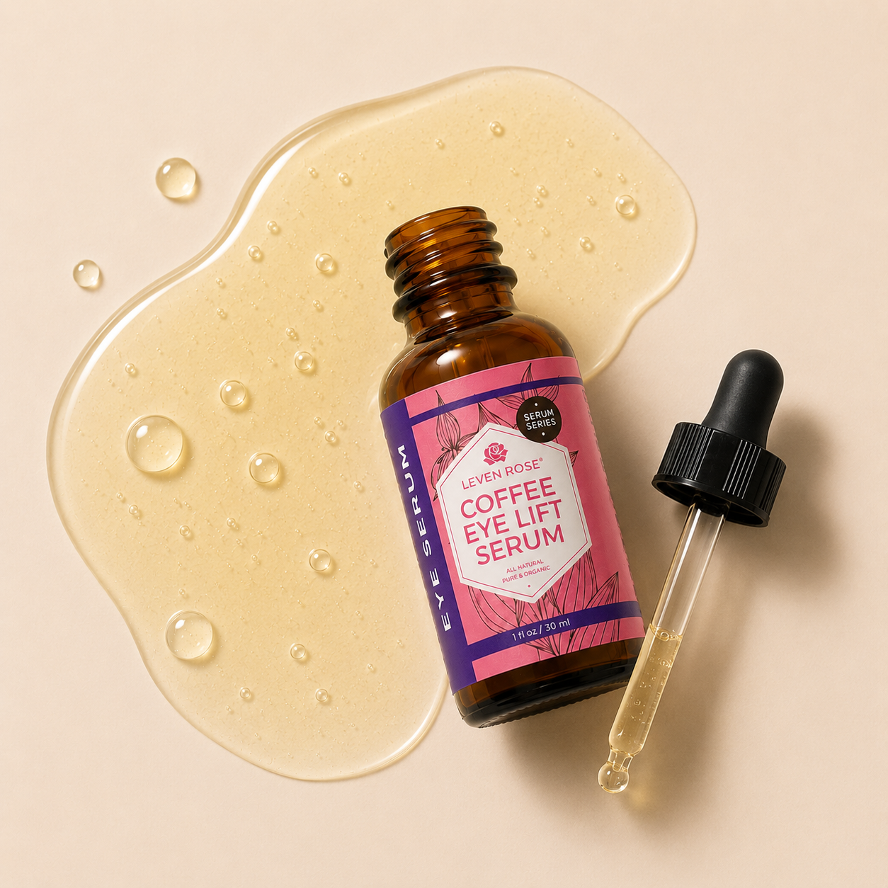 A small amber glass bottle of Urban Nose Coffee Eye Lift Serum with a pink and purple label, shown next to a clear dropper with a black cap on a beige background with a liquid smear and droplets.