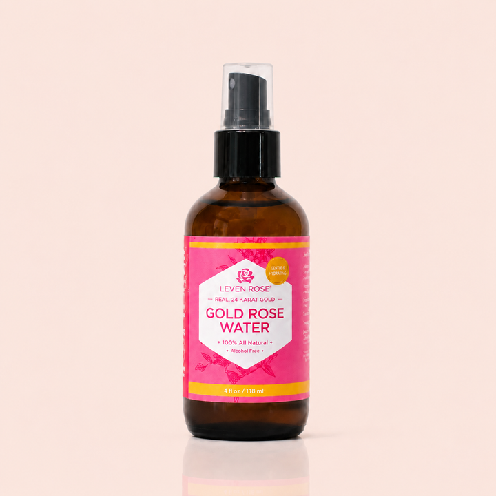 Bottle of Leven Rose Gold Rose Water on a beige background