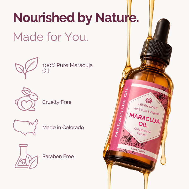 A bottle of Levon Rose Marajuca Oil with a pink label and black dropper cap, shown on a light background with gold oil dripping around it. Text on the left highlights 100% pure marajuca oil, cruelty free, made in Colorado, and paraben free.