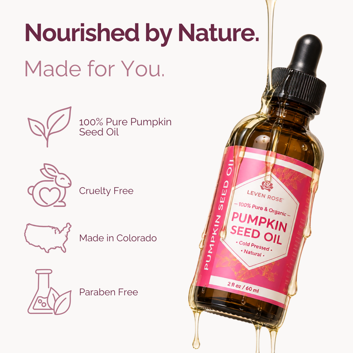 A bottle of Leven Rose Pumpkin Seed Oil with a pink label and dropper cap, shown on a light background with promotional text and icons about pure pumpkin seed oil, cruelty-free status, Made in Colorado, and paraben-free.