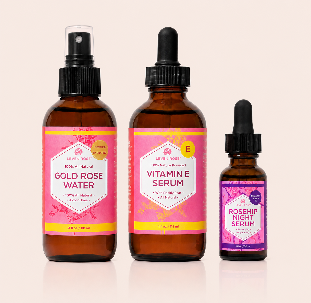 Three bottles of skincare products with pink labels on a beige background
